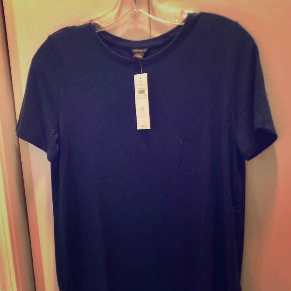 This is a brand new short sleeve, navy top.